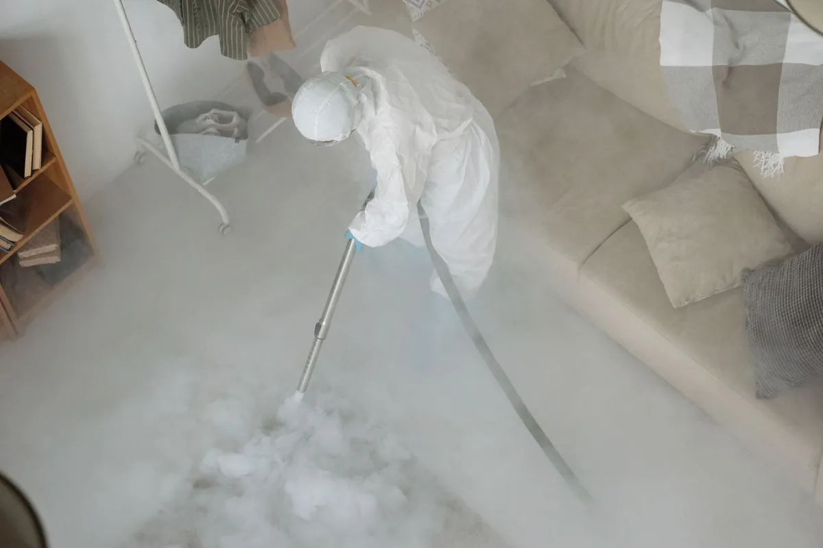 Biohazard cleanup technician in protective equipment, Clear Lake Shores, TX